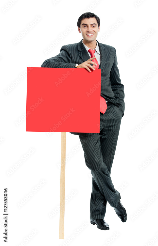 smiling businessman showing red signboard, isolated smiling businessman showing red signboard, isolated