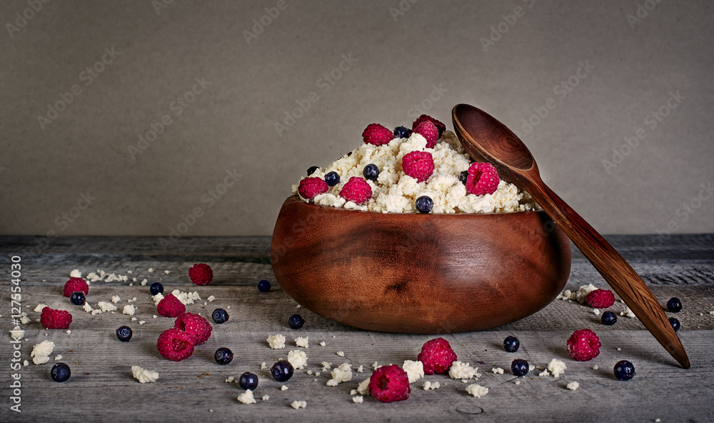 Cottage cheese and milk with fresh raspberries and blueberries o
