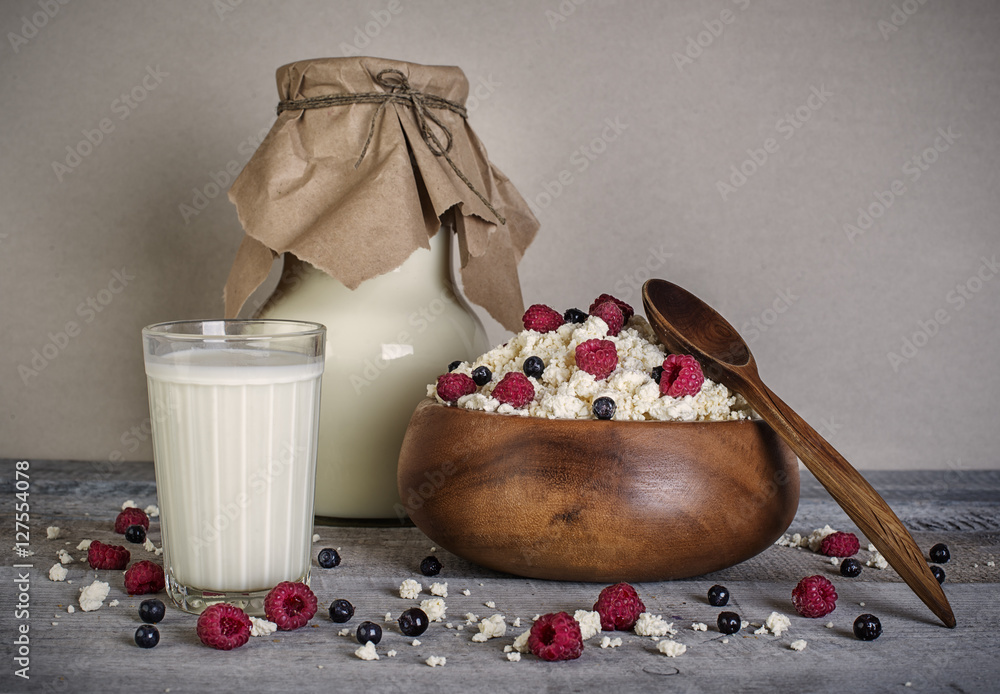Cottage cheese and milk with fresh raspberries and blueberries o