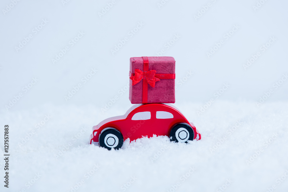 Little toy car with christmas gift box
