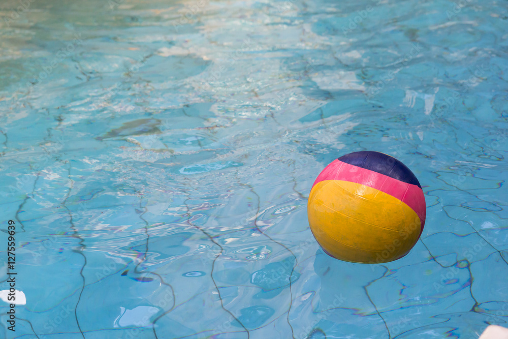 polo ball floating on water surface of pool