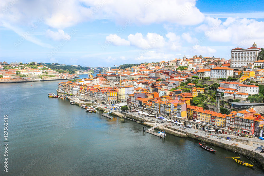 View of the historic city of Porto, Portugal with the Dom Luis bridge and blue sky /  Ancient city Porto,metallic Dom Luis bridge.