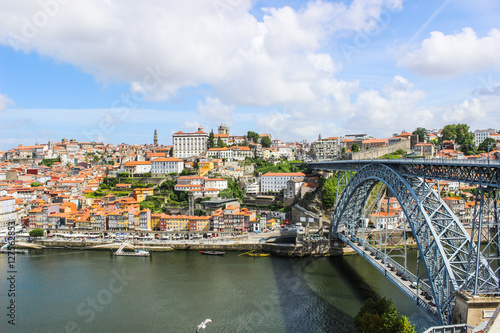 View of the historic city of Porto, Portugal with the Dom Luis bridge and blue sky / Ancient city Porto,metallic Dom Luis bridge.