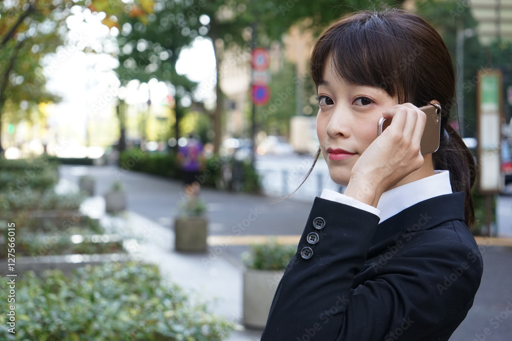 Young woman using a smart phone on the street Young woman using a smart phone on the street
