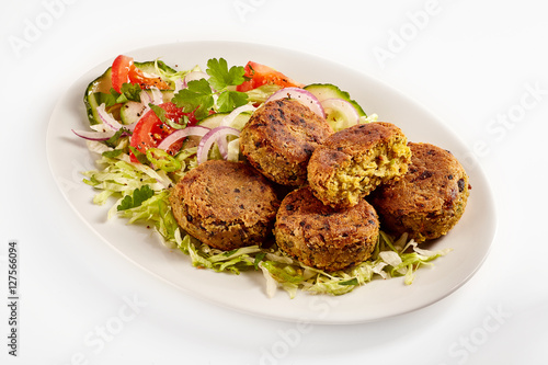 Oval plate of traditional falafel patties