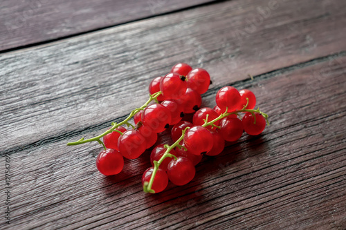 Closeup red currant berries on wooden table
