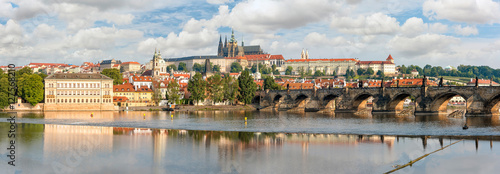 Panoramic view over river Vltava and Charles bridge to Prague castle. Copy space in clear sky