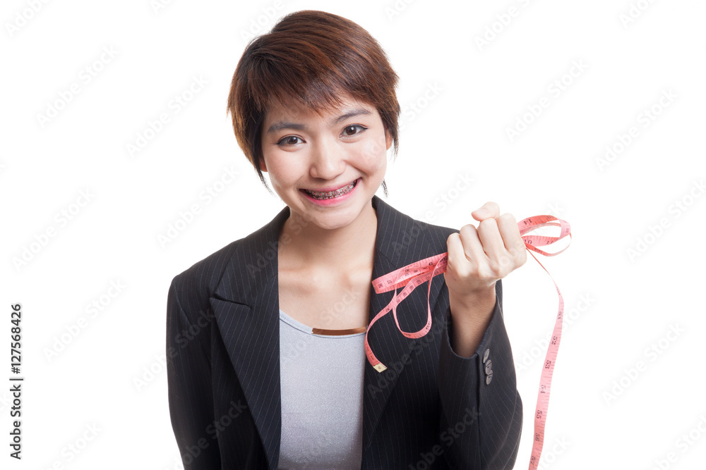 Young Asian business woman with measuring tape. Young Asian business woman with measuring tape.