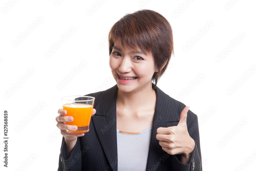 Young Asian woman thumbs up drink orange juice. Young Asian woman thumbs up drink orange juice.