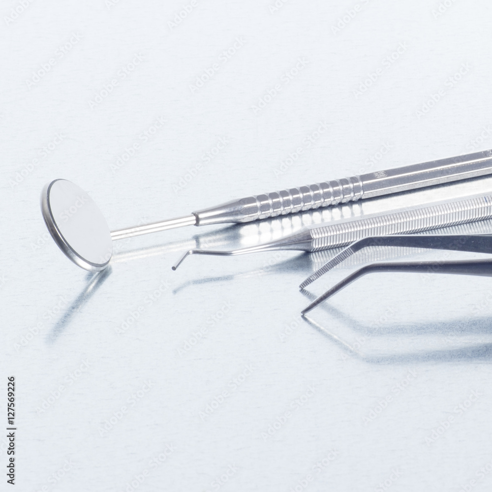 Fototapeta premium Dentist's tools (mirror, probe, tweezers)
