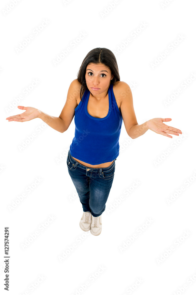hispanic woman shrinking shoulders open arms wondering confused in doubt hispanic woman shrinking shoulders open arms wondering confused in doubt