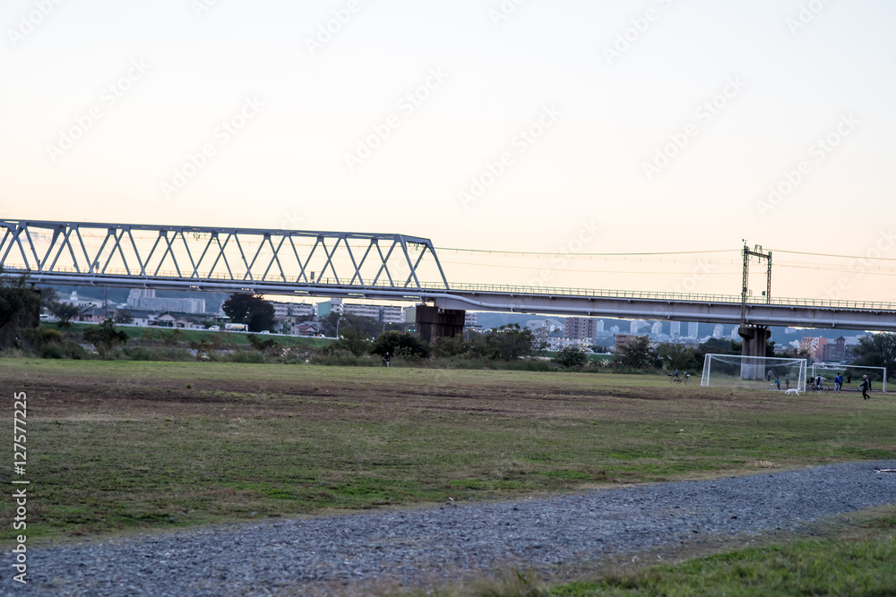 Iron bridge, riverbed,Sunset,soccer, in Japan Iron bridge, riverbed,Sunset,soccer, in Japan