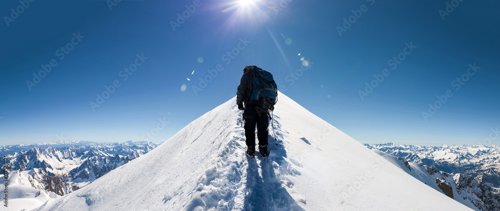 Fototapeta premium climbers approach the mountain top