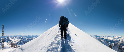 climbers approach the mountain top