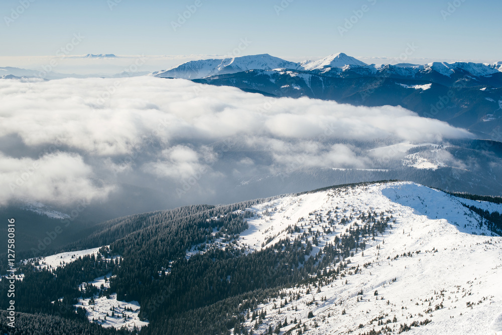 Incredible mountain landscape in winter, when you above the clou