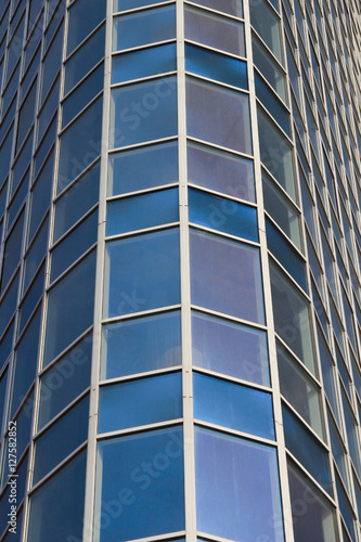 Glass windows of tall building. Close up
