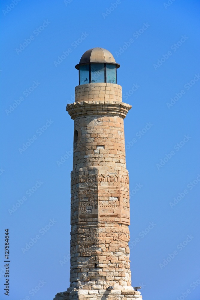 View of the lighthouse at the entrance to the harbour, Rethymno, Crete, Greece.