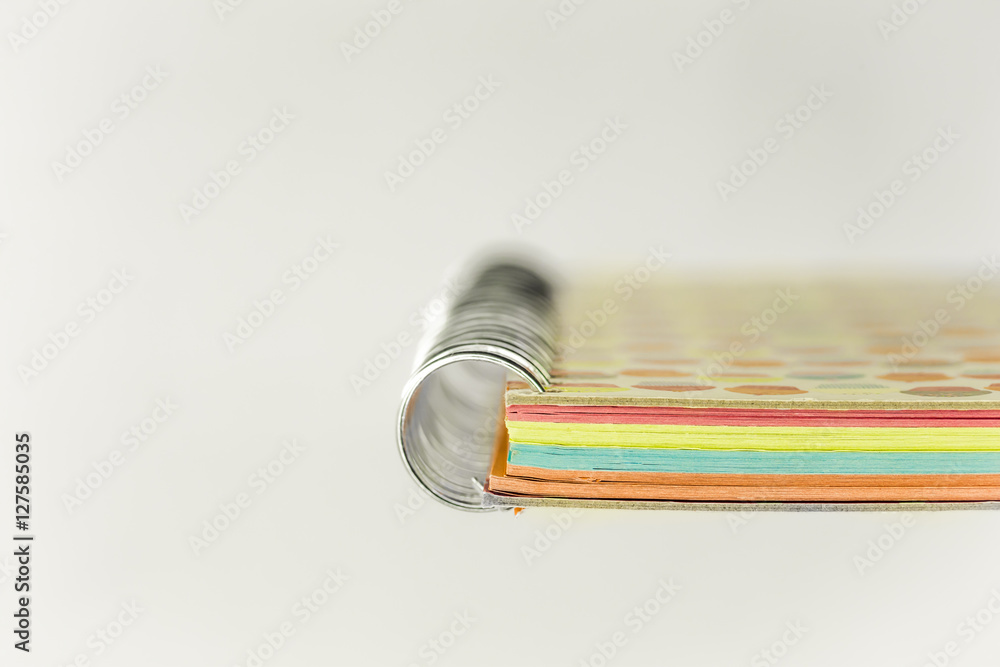 colored notebook with a spring on white background colored notebook with a spring on white background