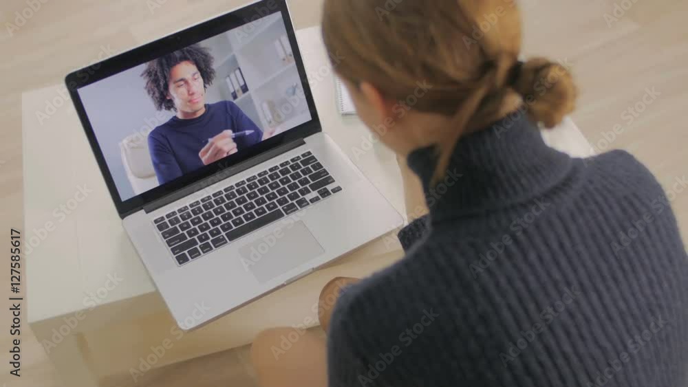 The girl talks in Skype to the client The girl talks in Skype to the client