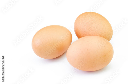 brown chicken eggs isolated on white background