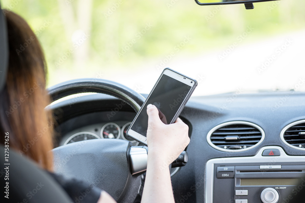 woman with a smartphone in the car woman with a smartphone in the car