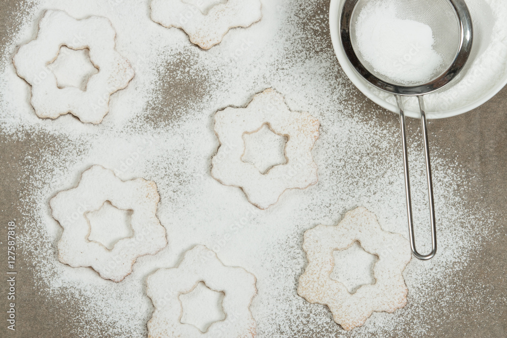 Homebaked Christmas Star Cookies, Icing Sugar. Decorating Proces Homebaked Christmas Star Cookies, Icing Sugar. Decorating Proces