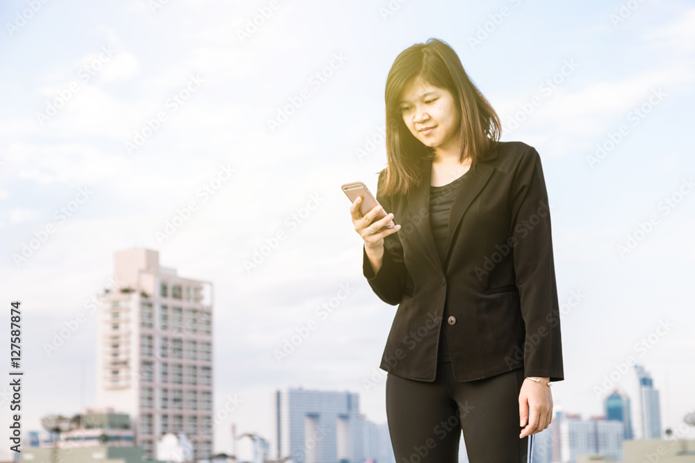 Happy Asian Businesswoman talking on smart phone. Happy Asian Businesswoman talking on smart phone.