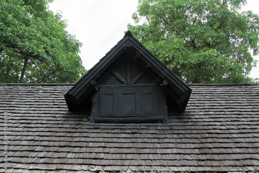Old seasoned wooden shingle tiled roof. Old seasoned wooden shingle tiled roof.