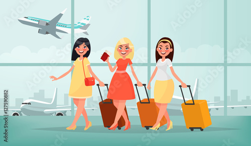 Air travel to warm countries. Three happy friends women with lug photo