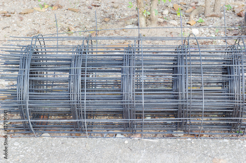 Rolls of steel wire mesh on the ground, horizontal photo photo