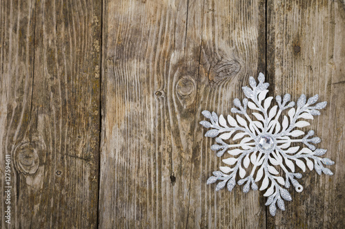 Christmas ornaments on the wooden background.