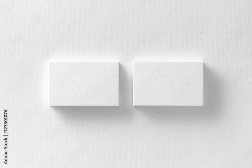 Mockup of two horizontal business cards stacks at white paper Mockup of two horizontal business cards stacks at white paper