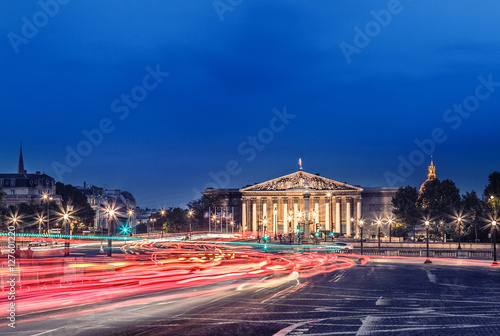 The Bourbon Palace is the place where National Assembly meets. It located on the left bank of the Seine, across from the Place de la Concorde. Paris cityscape night view.