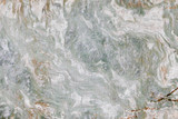 Smooth abstract stone texture with green elements