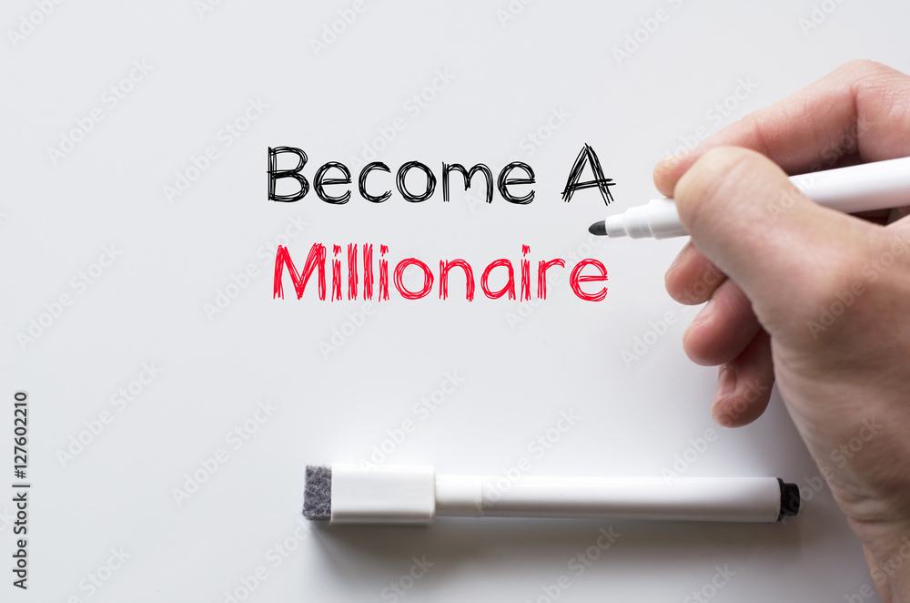 Become a millionaire written on whiteboard Become a millionaire written on whiteboard
