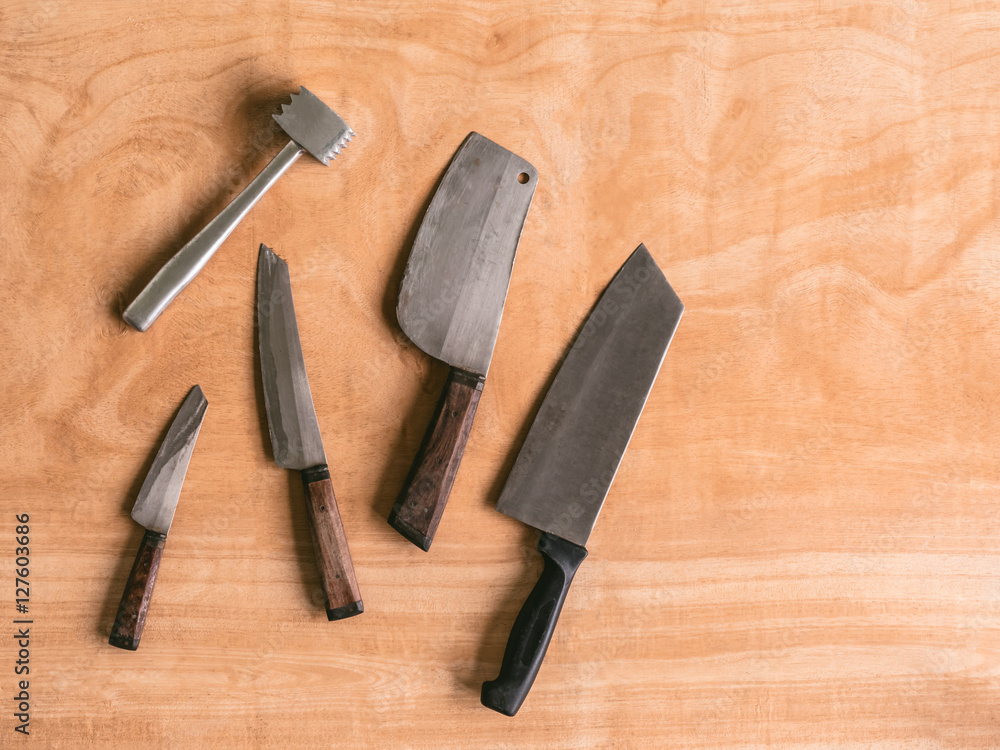 Kitchen utensils on wooden table background.