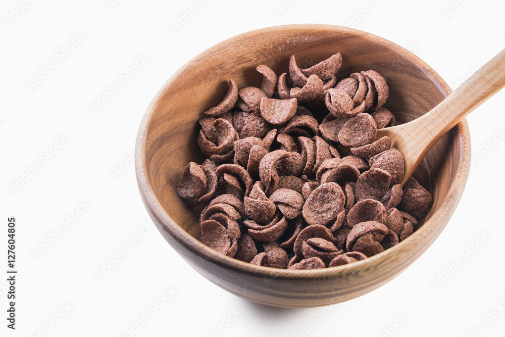 Fototapeta premium Isolate cocoa cereal on wooden bowl