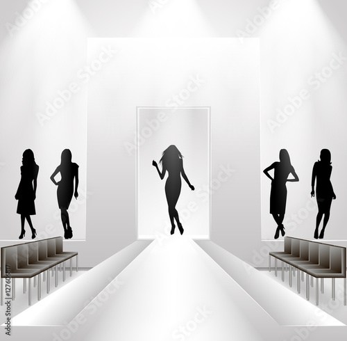 Female silhouettes on catwalk background