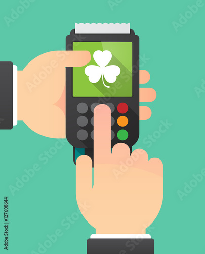 Hands with a dataphone with a clover