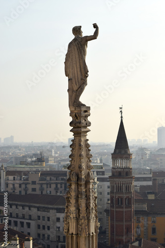 Gothic ornaments and sculptures of Duomo and Milan panorama