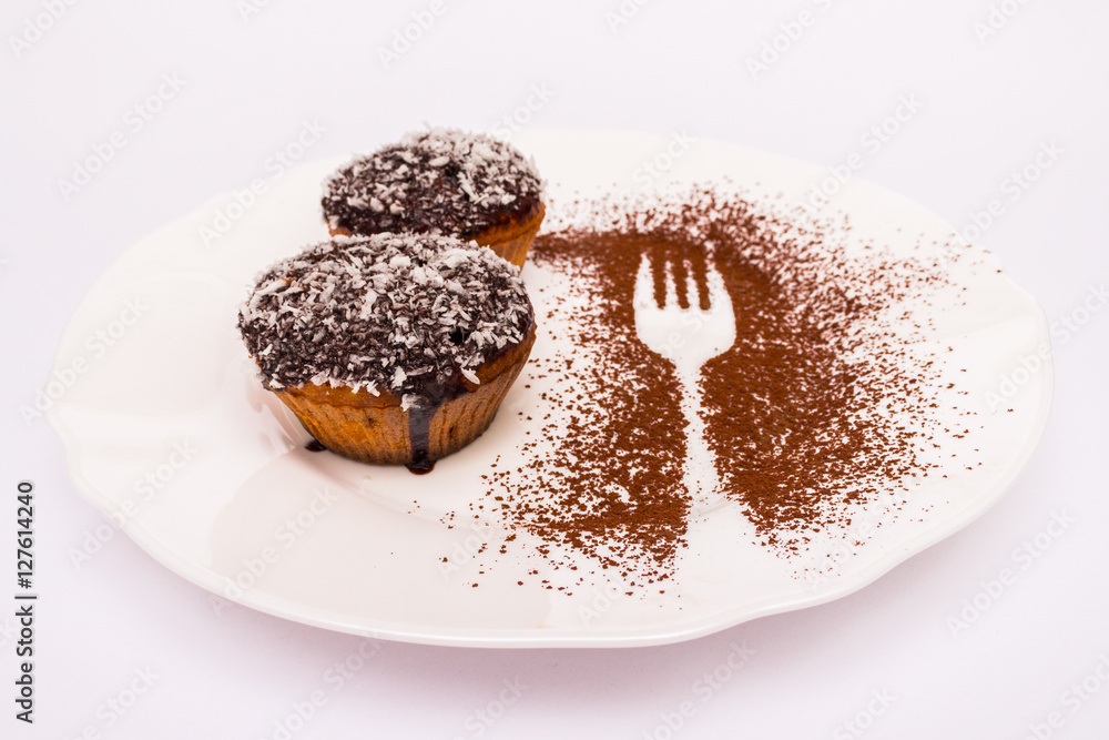 Cupcake with chocolate and coconut chips sprinkled on top isolated Cupcake with chocolate and coconut chips sprinkled on top isolated