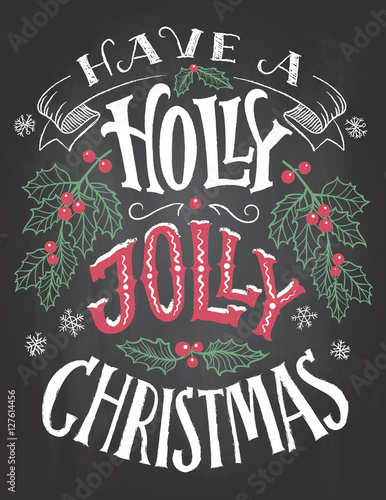 Have a holly jolly Christmas. Vintage hand lettering on blackboard background with chalk. Holiday chalkboard typography