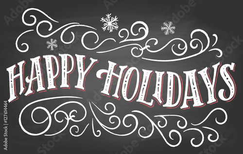 Happy holidays. Vintage hand lettering on blackboard background with chalk. Christmas typography