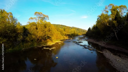 aerial shot of Green Valley during with River, autumn in Bieszczady, Poland photo