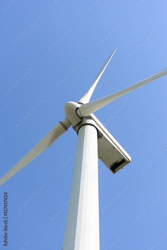 Wind generator, on a background of blue sky. Wind generator, on a background of blue sky.