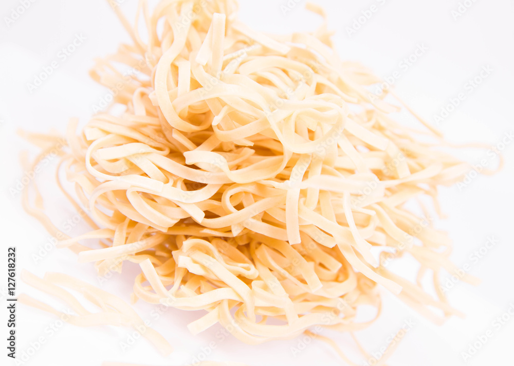 Row chow mein noodles on a white background
