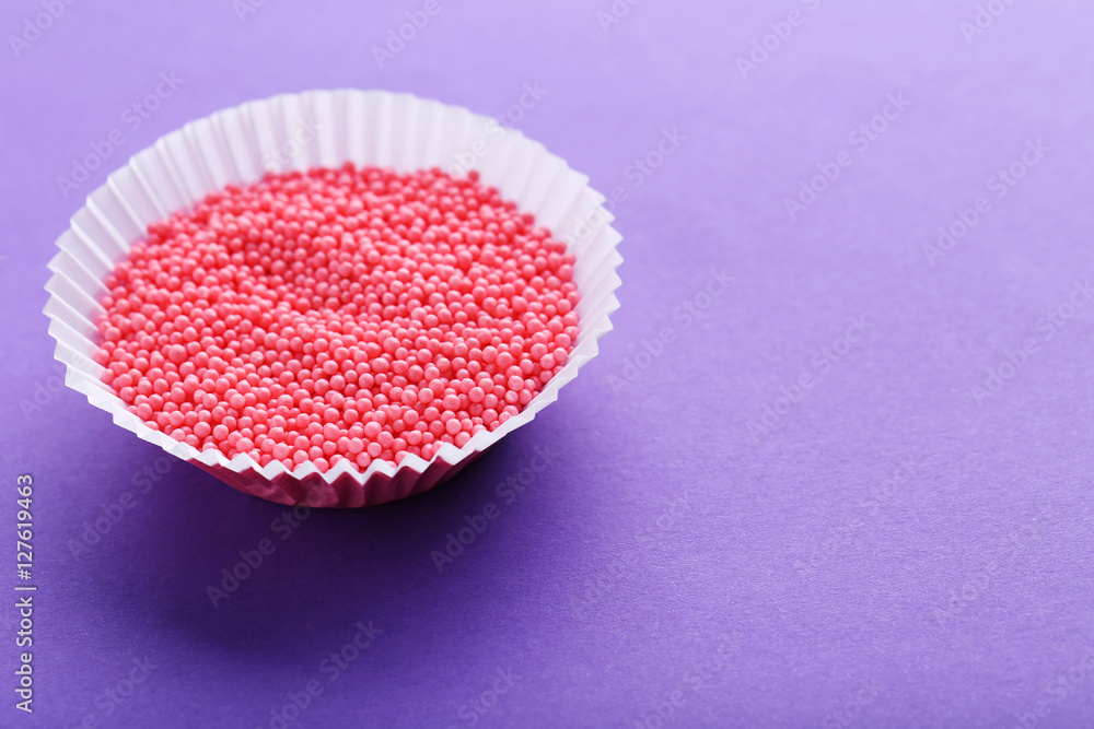 Colorful sprinkles on a purple background Colorful sprinkles on a purple background