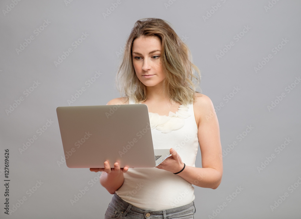Smart beautiful young girl using laptop Smart beautiful young girl using laptop