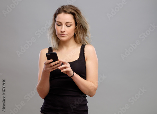 Casual woman using her smartphone