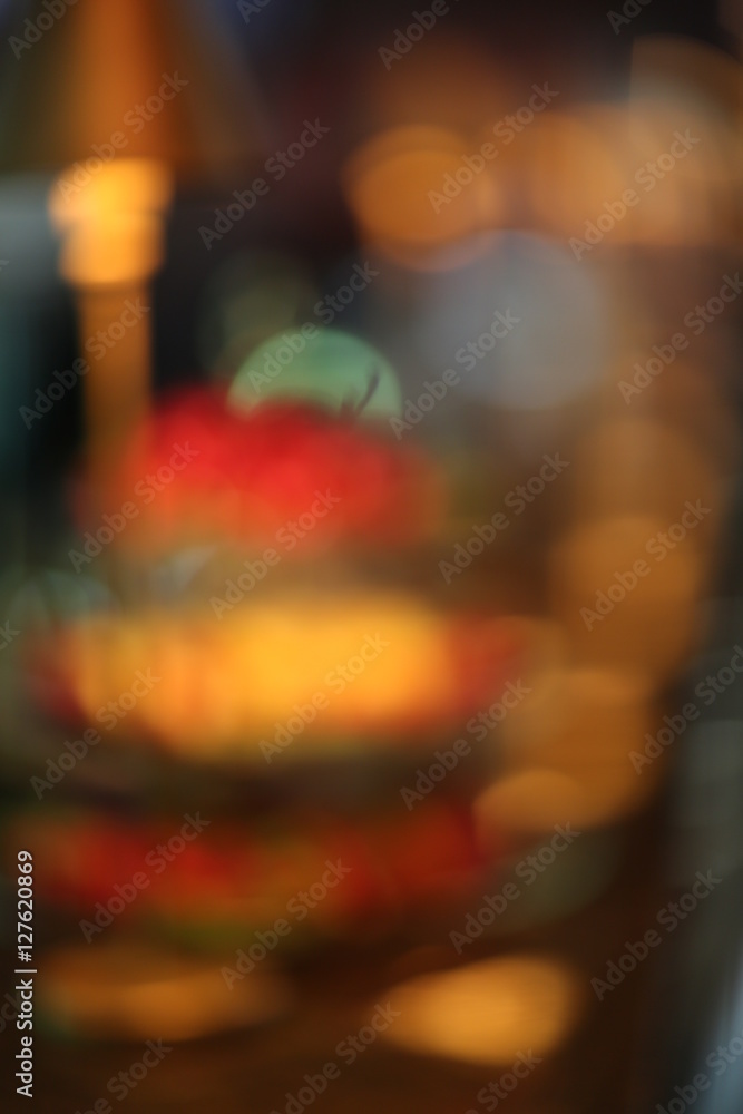 Abstract three tiered tray with fruits. Close up. Blurred background